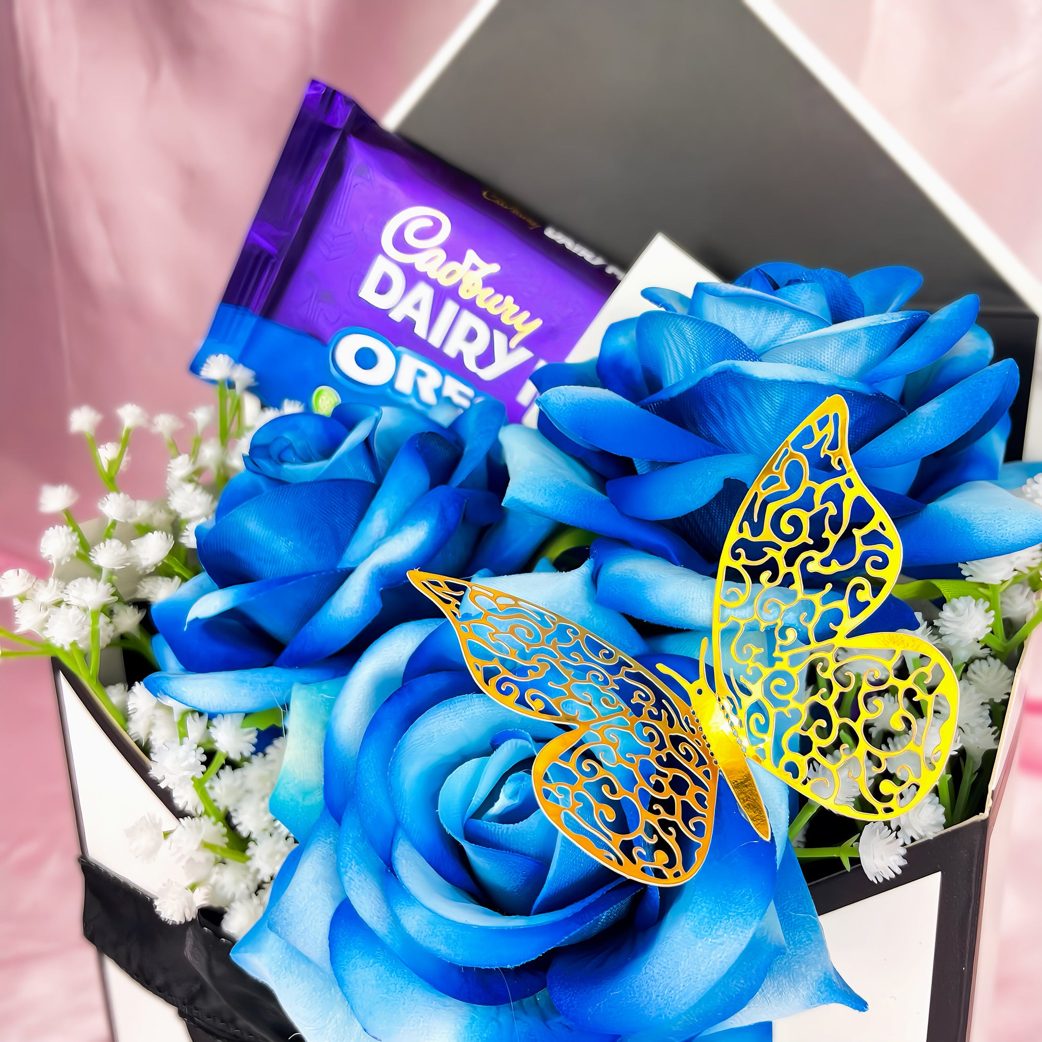 Stunning Envelope Style Chocolate & Flower Arrangement - Inc. Cadbury Oreo Chocolate Bar, 3x Blue Forever Roses & Personalised Postcard
