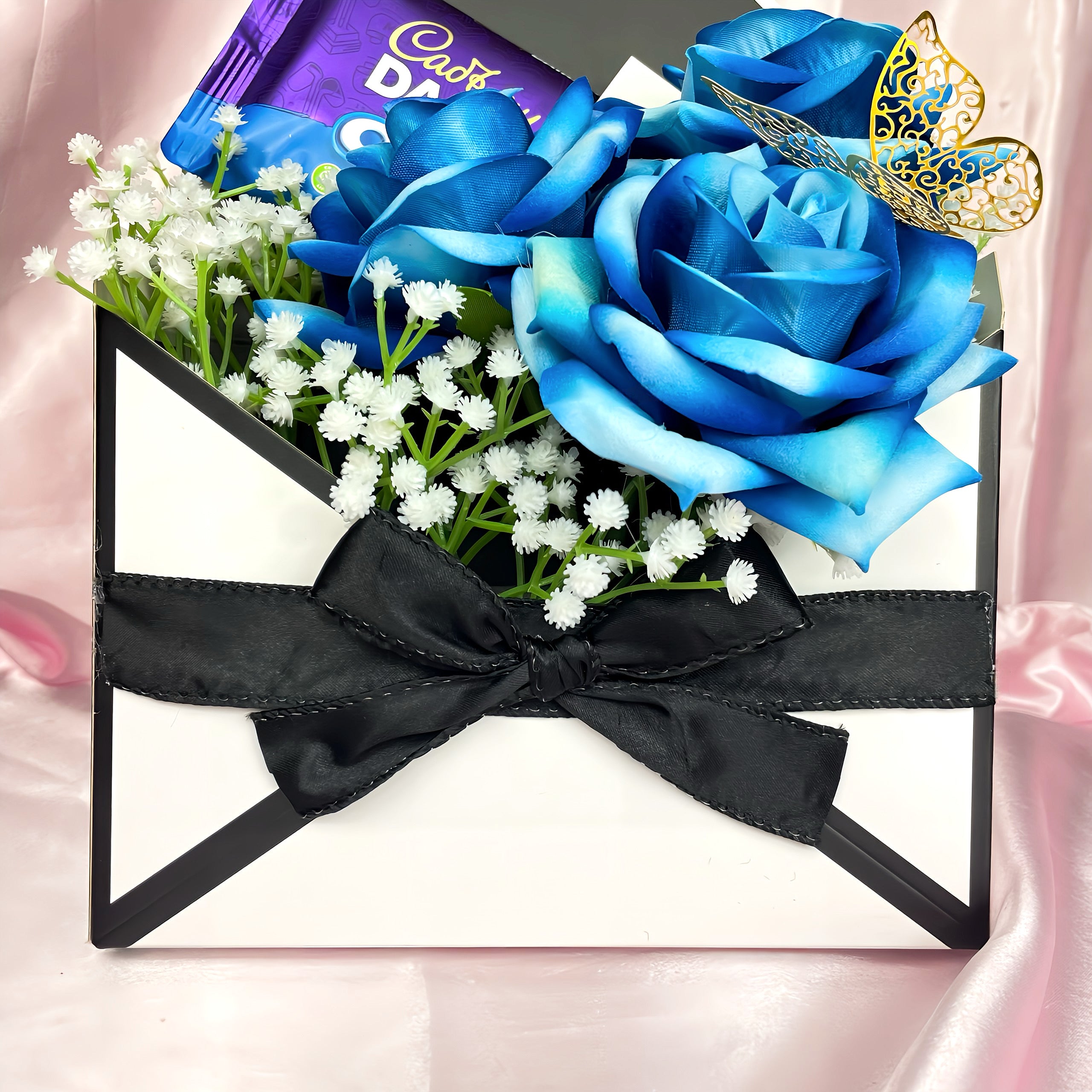 Stunning Envelope Style Chocolate & Flower Arrangement - Inc. Cadbury Oreo Chocolate Bar, 3x Blue Forever Roses & Personalised Postcard