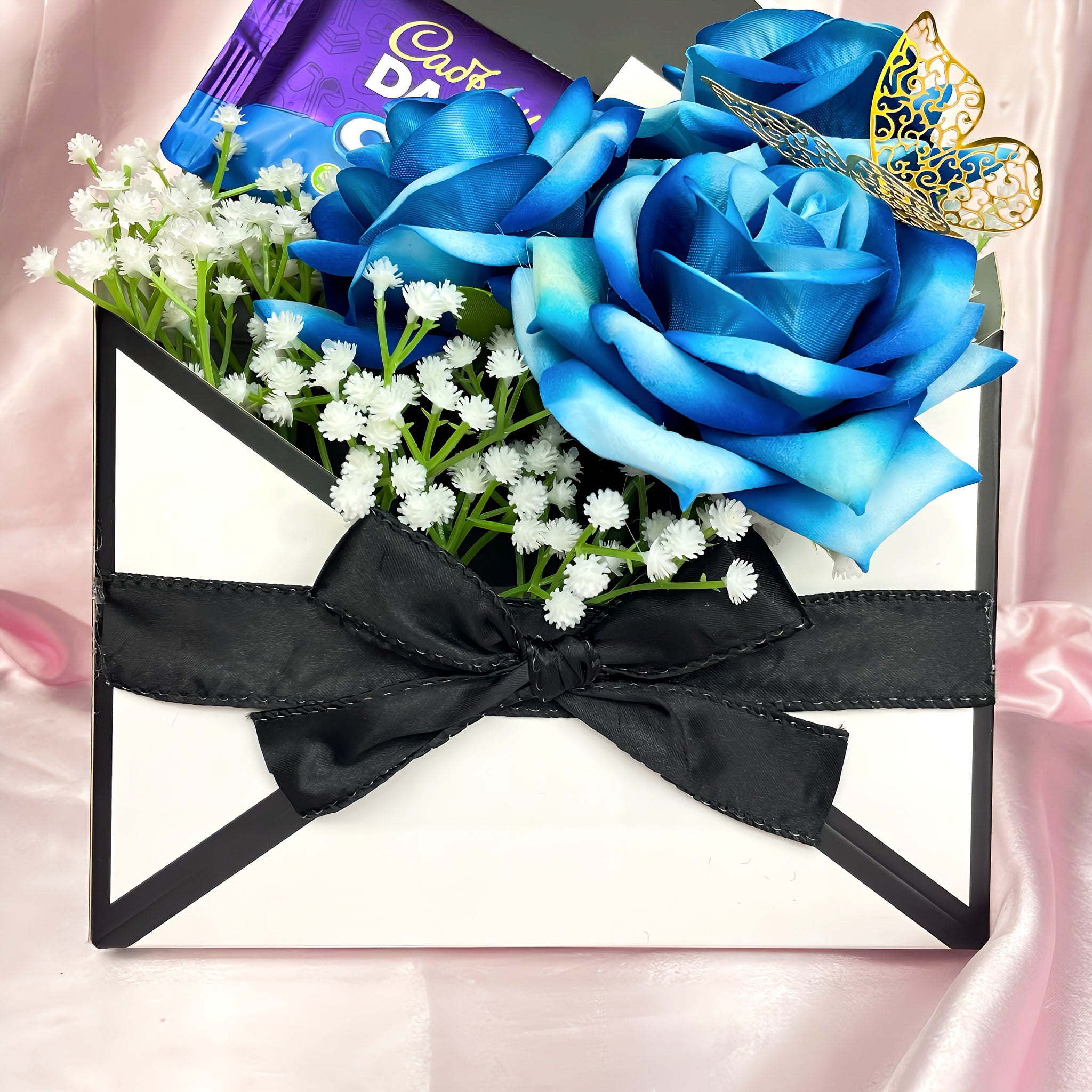 Stunning Envelope Style Chocolate & Flower Arrangement - Inc. Cadbury Oreo Chocolate Bar, 3x Blue Forever Roses & Personalised Postcard