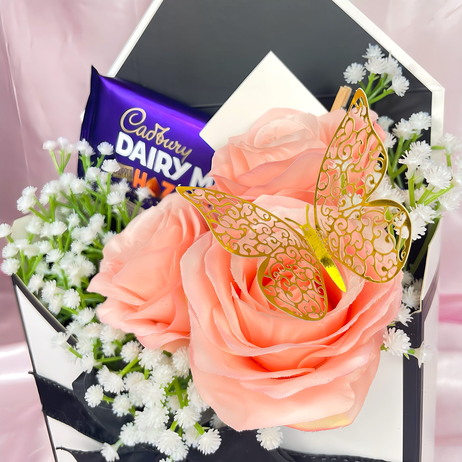 Stunning Envelope Style Chocolate & Flower Arrangement - Inc. Cadbury Hazelnut Chocolate Bar, 3x Pink Forever Roses & Personalised Postcard