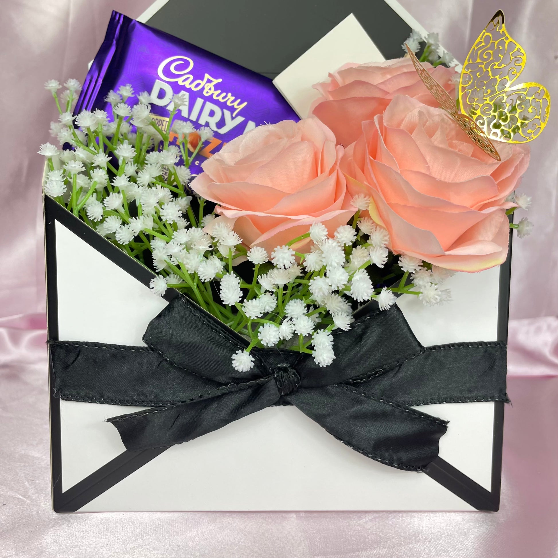 Stunning Envelope Style Chocolate & Flower Arrangement - Inc. Cadbury Hazelnut Chocolate Bar, 3x Pink Forever Roses & Personalised Postcard